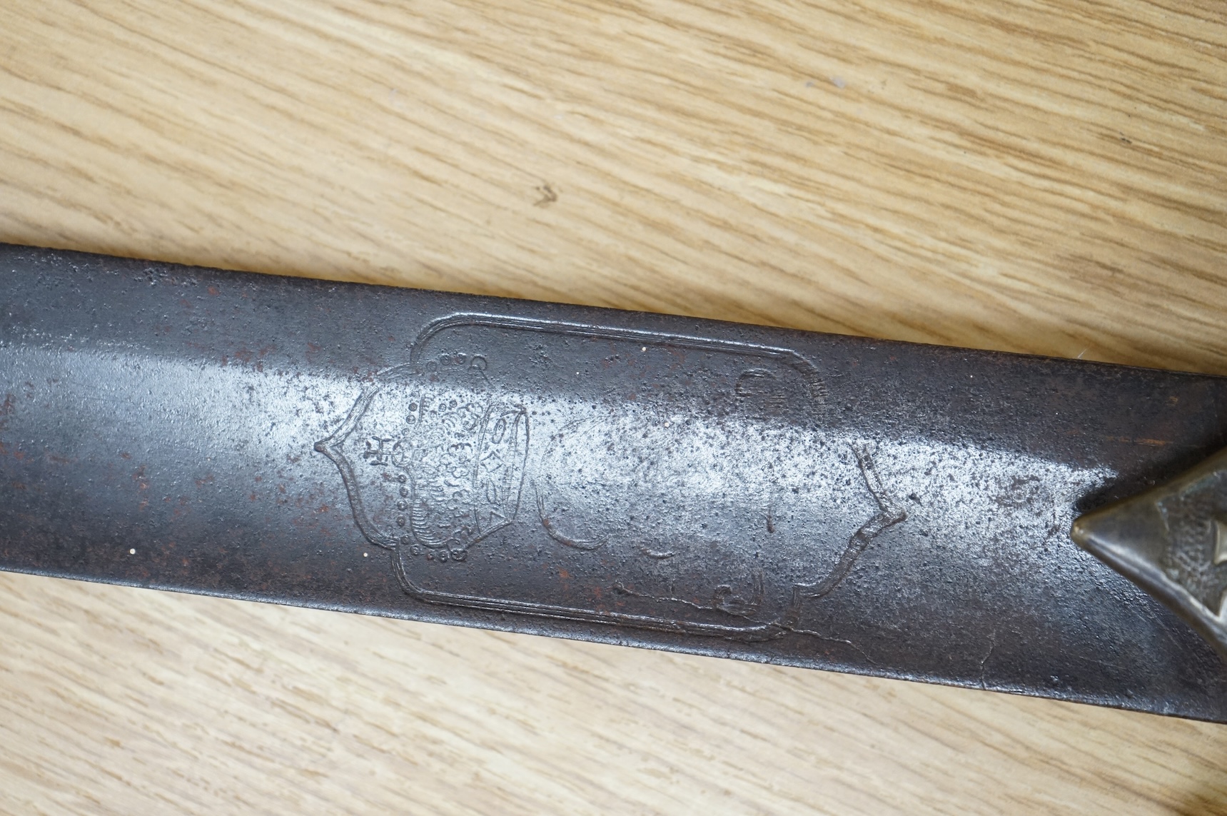 A scarce Germanic Janissary Corps sidearm, produced from 1729-31, broad single edged blade, 65cm, etched in panel with crowned cipher (faint), regulation cast brass hilt with crowned cipher and chevron grip